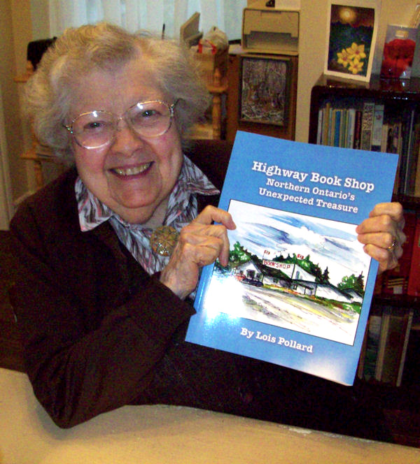 Lois Pollard with her book on the history of the Highway Book Shop